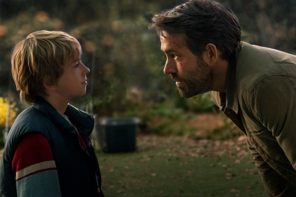 Ryan Reynolds as Big Adam and Walker Scobell as young Adam Reed - The Adam Project