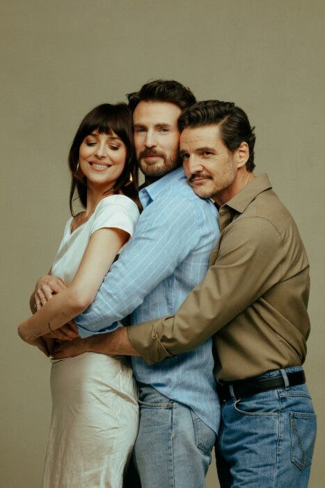 Dakota Johnson, Chris Evans, and Pedro Pascal pose together behind the scenes of “Materialists” photoshoot