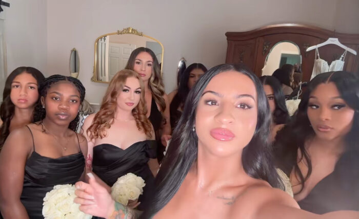 Leanna Lenee posing with her bridal party at her wedding in Tennessee