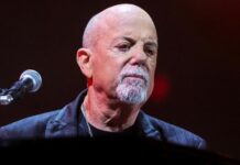 Billy Joel Cancels Tour After Brain Condition Diagnosis Billy Joel performing live before canceling his tour due to normal pressure hydrocephalus diagnosis.
