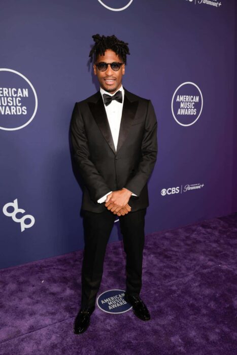 Jon Batiste on the purple carpet at the 2025 AMAs