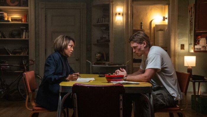 Roman (Regina King) sits down with Hank (Austin Butler) to get some answers in Caught Stealing by Columbia Pictures.