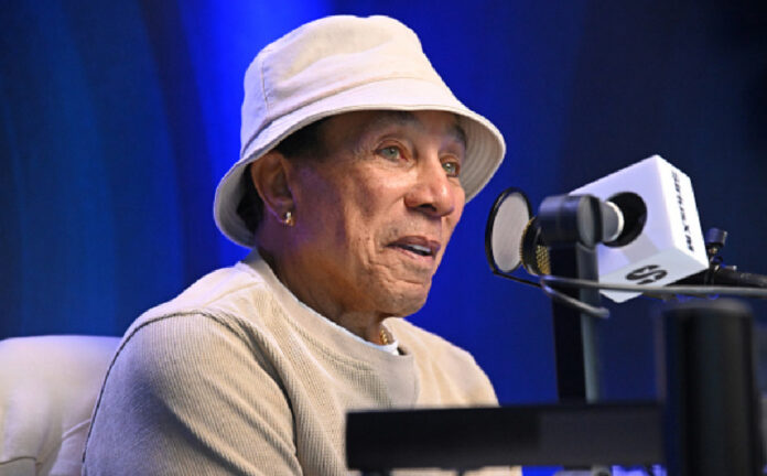 smokey-robinson-responds-to-sexual-assault-lawsuit-2025 Smokey Robinson speaking at an event before responding to sexual assault allegations filed in a 2025 civil lawsuit.