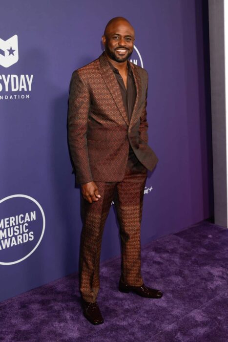 Wayne Brady on the purple carpet at the 2025 American Music Awards