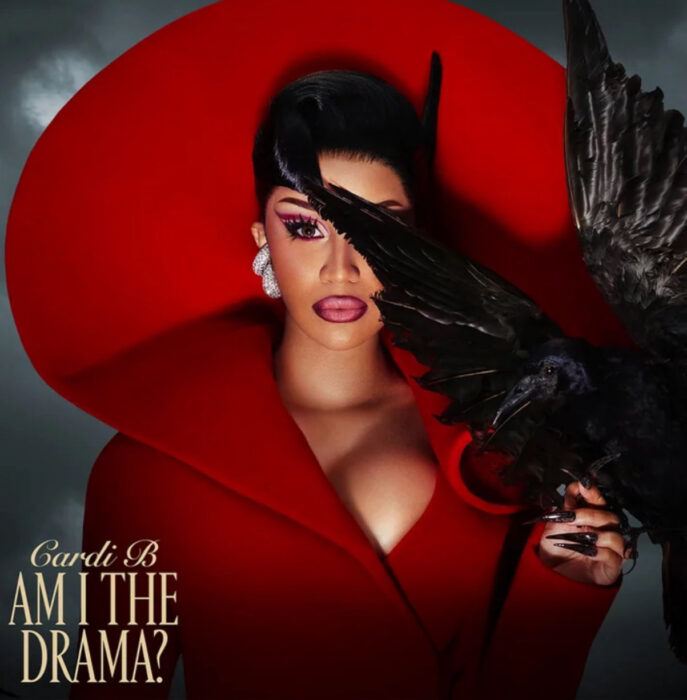 Cardi B poses in red for her “Am I The Drama?” album artwork
