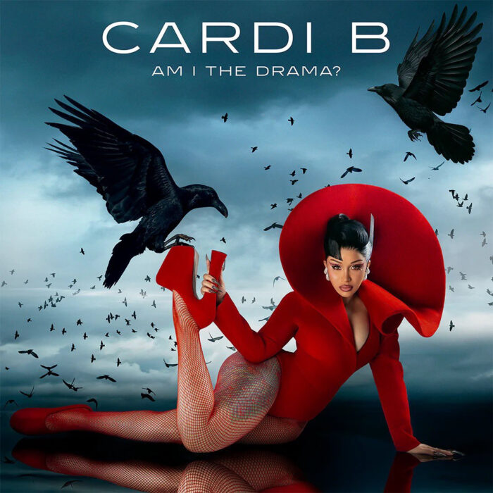Cardi B poses in red for her “Am I The Drama?” album artwork