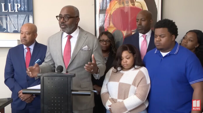 Jessica Ross and Traveon Taylor Sr. outside of the courthouse after winning a $2.25 million verdict against Dr. Jackson Gates for sharing graphic autopsy footage of their deceased infant on social media.