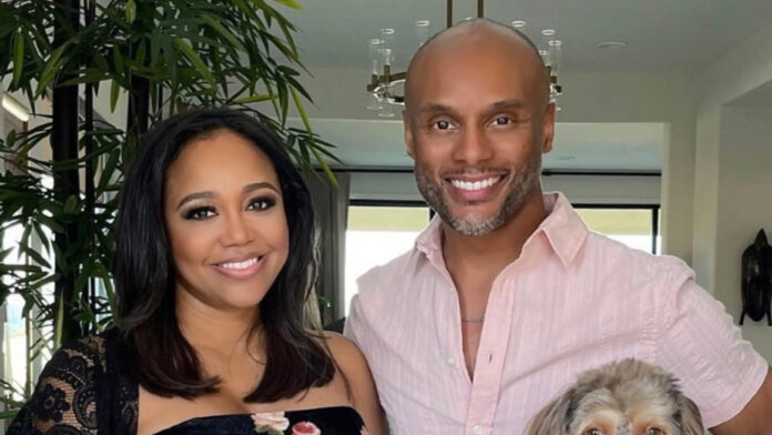 Judge Faith Jenkins and Kenny Lattimore at a red carpet event smiling together