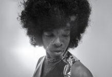 Sly Stone: Music Pioneer & Funk Legend Passes Away At 82 Black and white photo of Sly Stone