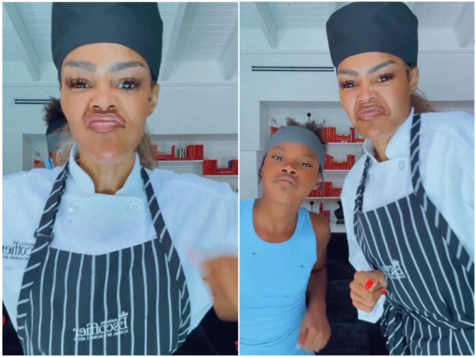 Teyana Taylor wearing a chef’s coat on her first day of culinary school with her daughter Junie by her side