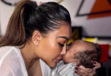 Rada Darling Clarifies Her ‘Walking Alone’ Post About Postpartum Depression Rada Darling snuggles with her baby boy while addressing postpartum depression comments