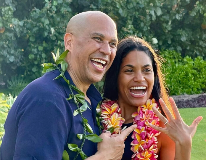 Senator Cory Booker proposes to Alexis Lewis on the beach during their romantic engagement