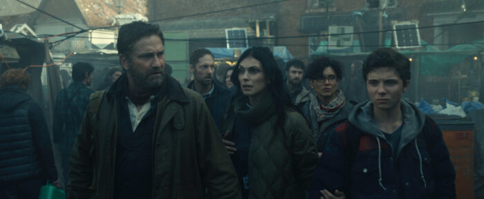 Morena Baccarin as Allison Garrity, Gerard Butler as John Garrity, and Roman Griffin Davis as Nathan Garrity in Greenland 2: Migration
