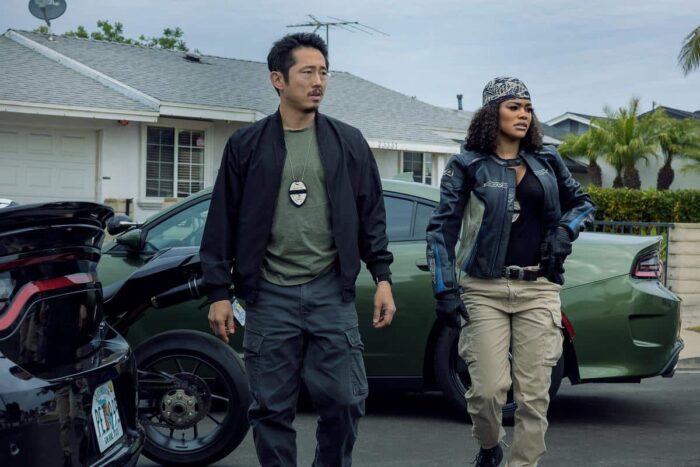 Steven Yeun as Detective Mike Ro and Teyana Taylor as Detective Numa Baptiste in Netflix action thriller The Rip.