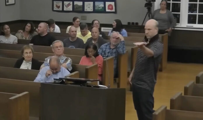 "Will Thilly breakdances at Cranford town hall meeting during property tax protest"