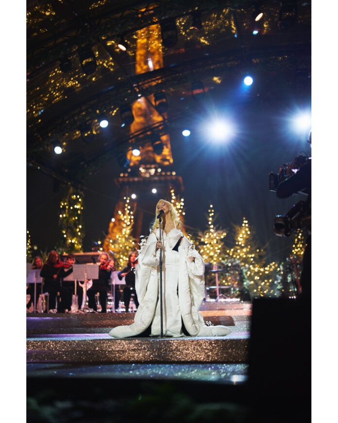Christina Aguilera sings holiday classics in Paris as the Eiffel Tower shines like a Christmas tree during her CBS special.