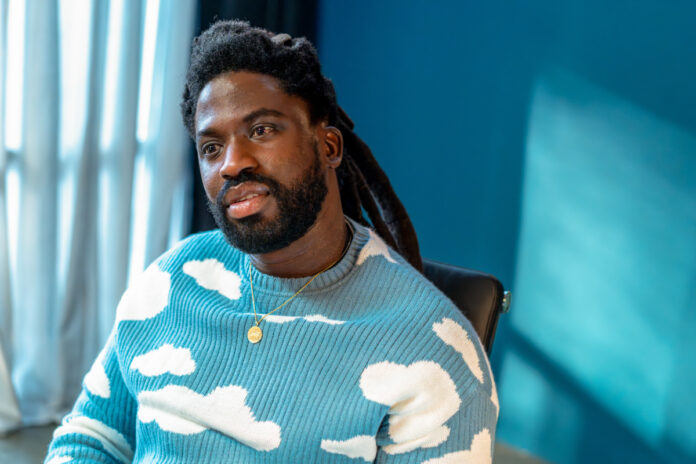 Adjani Salmon as Kwabena in Dreaming Whilst Black, season 2,