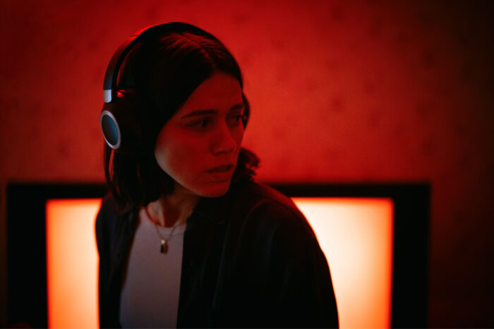 Nina Kiri stars in A24’s undertone, playing a paranormal podcast host haunted by mysterious audio recordings