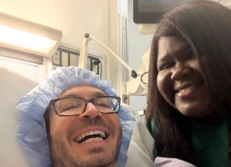 Gabourey Sidibe’s Husband Brandon Frankel Reveals Thyroid Cancer And Says Advocating For Himself Saved His Life Brandon Frankel in hospital bed recovering from thyroid cancer surgery with wife Gabourey Sidibe by his side smiling and holding him