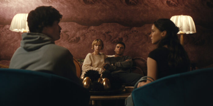 Charles Melton as Austin Davis, Carey Mulligan as Lindsay Crane-Martín, Oscar Isaac as Joshua Martín, and Cailee Spaeny as Ashley Miller in "Beef" Season 2 on Netflix.