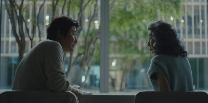 Song Kang-ho as Dr. Kim and Youn Yuh-jung as Chairwoman Park in Episode 203 of Beef Season 2 on Netflix.