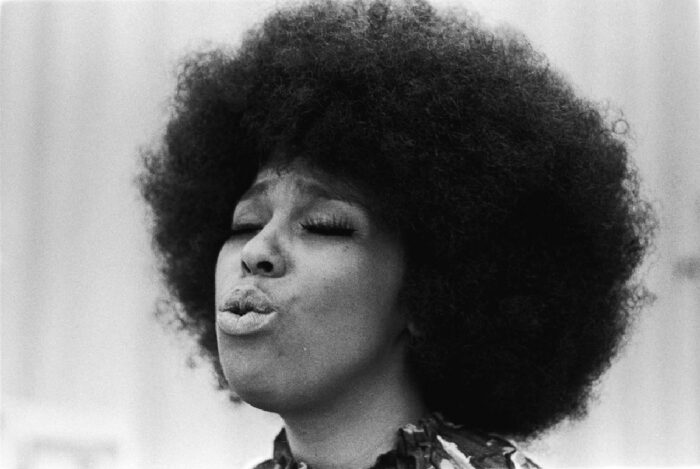 Roberta Flack singing during a live performance, highlighting the legendary vocalist featured in OWN’s documentary “OWN Spotlight: Roberta.”