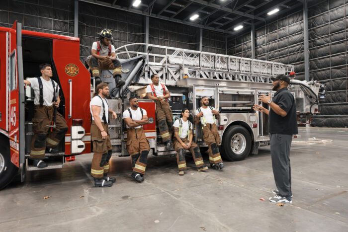 Tyler Perry with the firefighter cast of “Tyler Perry’s Where There’s Smoke” during production in Atlanta for the Netflix drama series