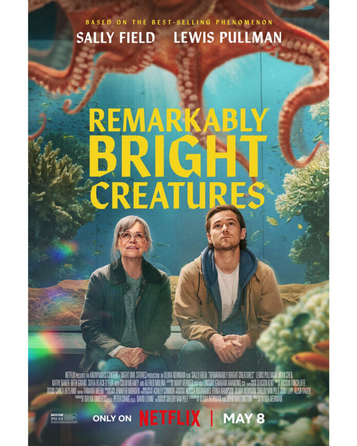 Sally Field in “Remarkably Bright Creatures” Netflix key art featuring Tova and a giant Pacific octopus Marcellus in an aquarium setting