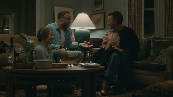 Seth Rogen, Penélope Cruz, Olivia Wilde, and Edward Norton in "The Invite" (2026) cast photo featuring the ensemble in a tense, intimate setting
