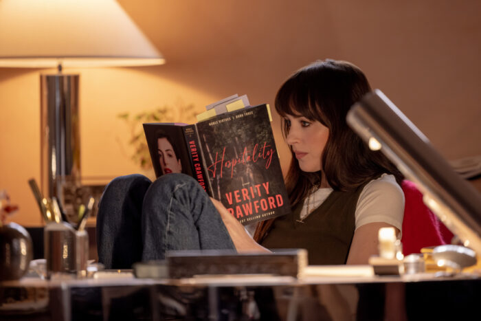 Dakota Johnson reading Verity Crawford manuscript in Verity teaser trailer suspense scene