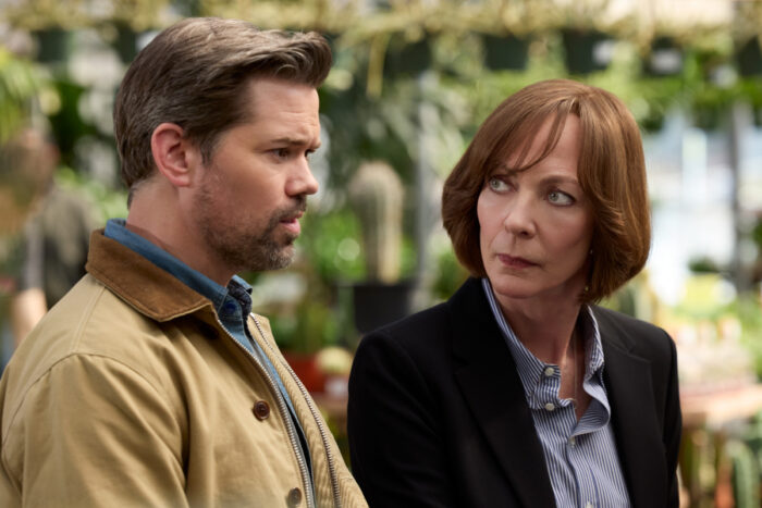 Allison Janney and Andrew Rannells in Miss You, Love You (2026) sharing a serious conversation in a bright indoor setting