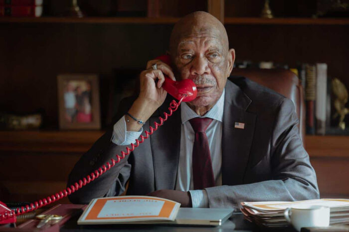 Morgan Freeman as Edwin Mullins during a briefing.